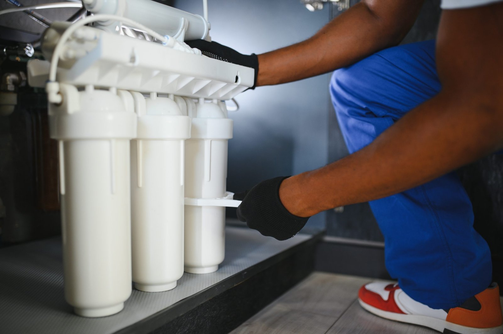 Plumber Installing Water Filtration System